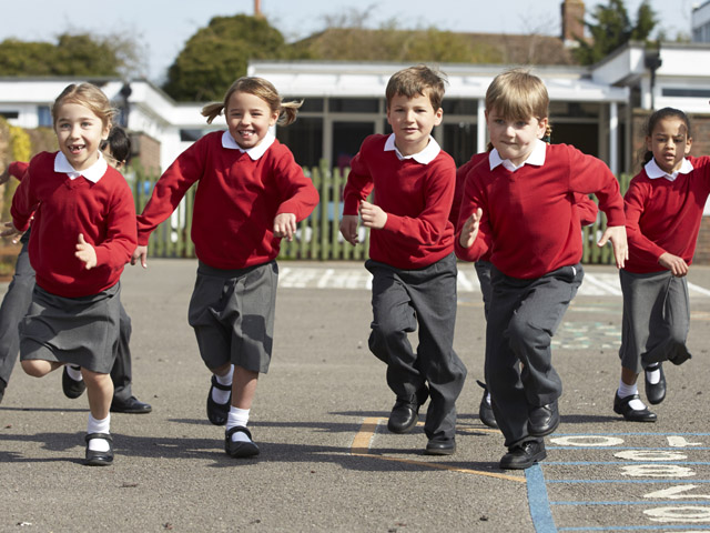 Elementary Students running on playground