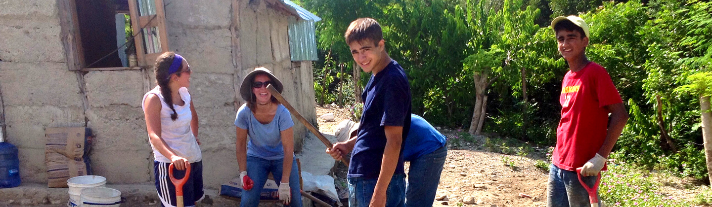 st. john the beloved youth missionaries getting ready to lay down a cement floor.