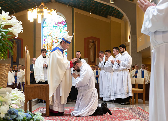 Bishop with newly ordained transitional deacon