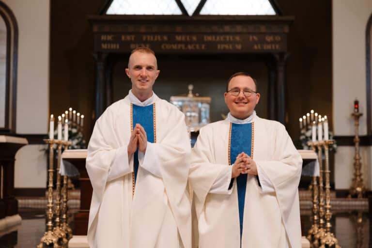 Two new priests after being ordained.