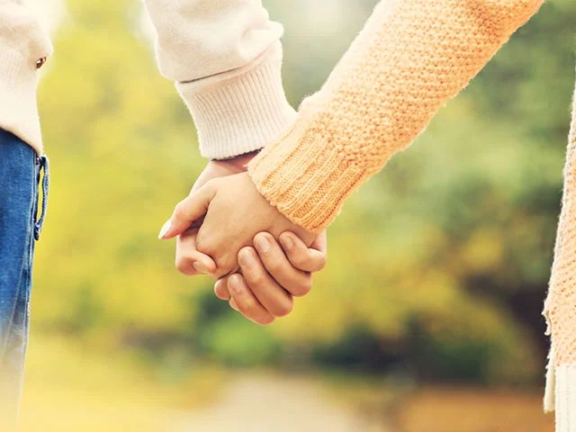 fc couple holding hands